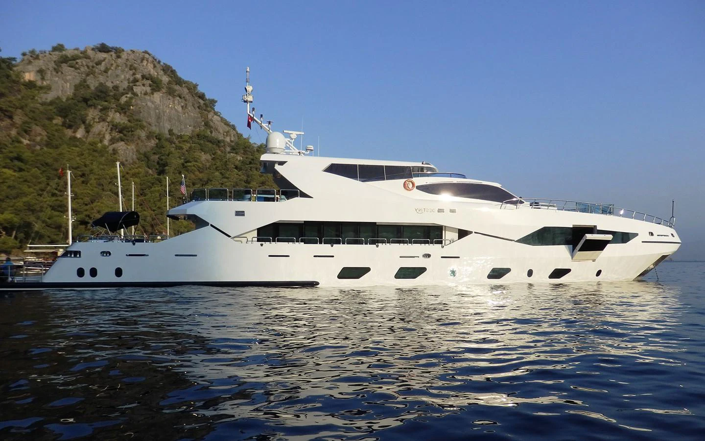 a white yacht on the water aboard DESTINY Yacht for Sale