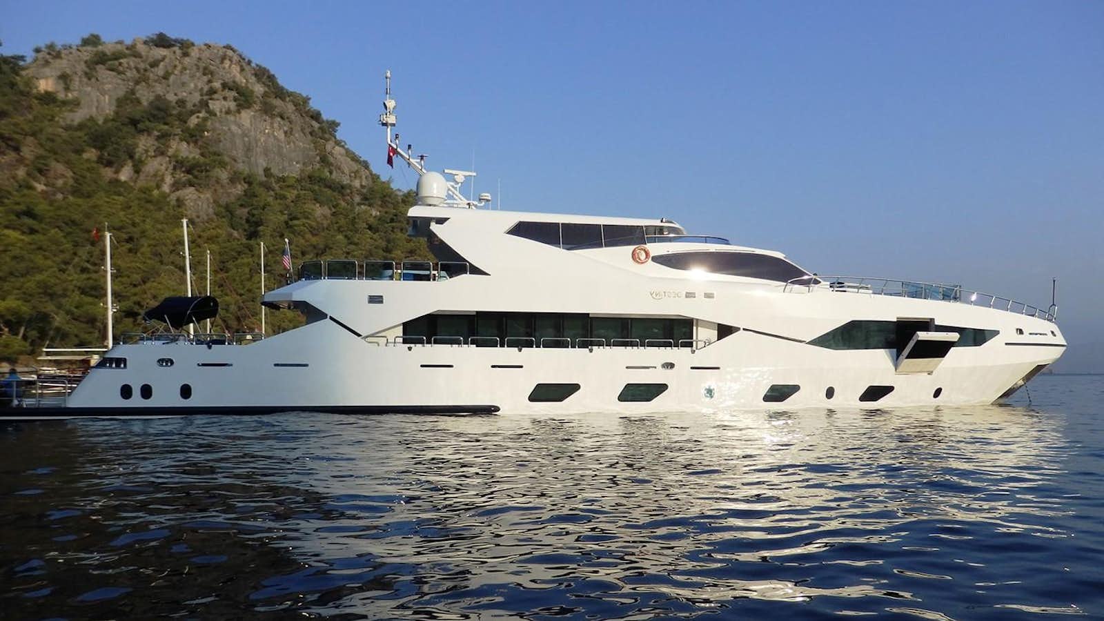 a white yacht on the water aboard DESTINY Yacht for Sale