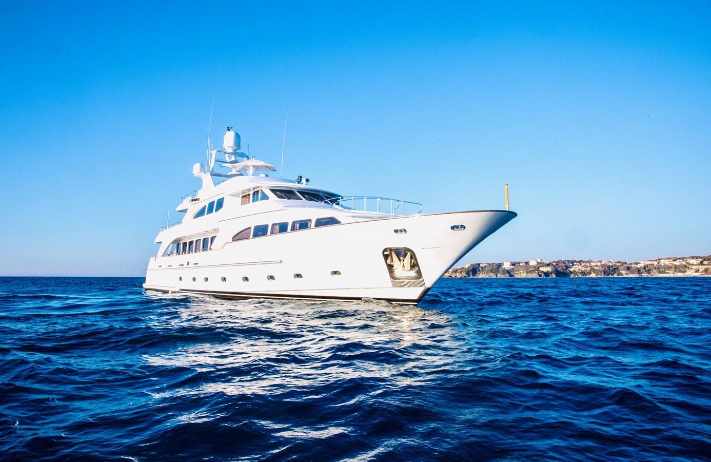 a white yacht in the water aboard SERENO Yacht for Sale