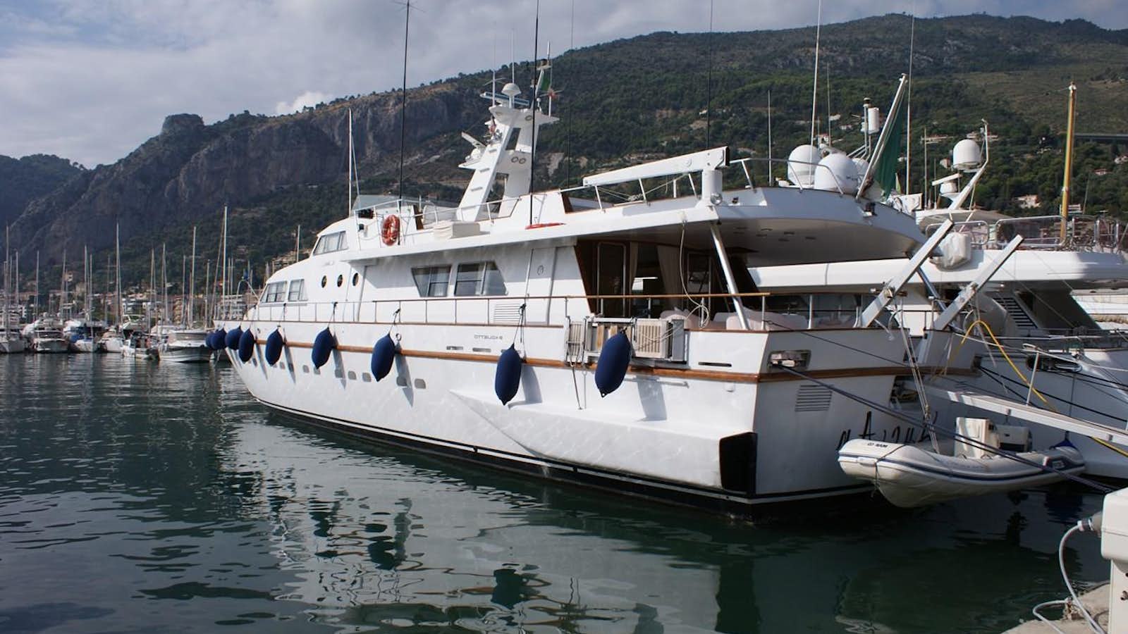 a couple of boats are parked in a harbor aboard LUC AN Yacht for Sale