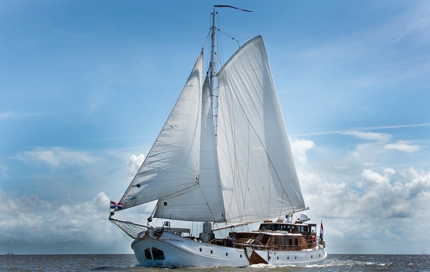 a boat on the water aboard DE VROUWE CHRISTINA Yacht for Sale