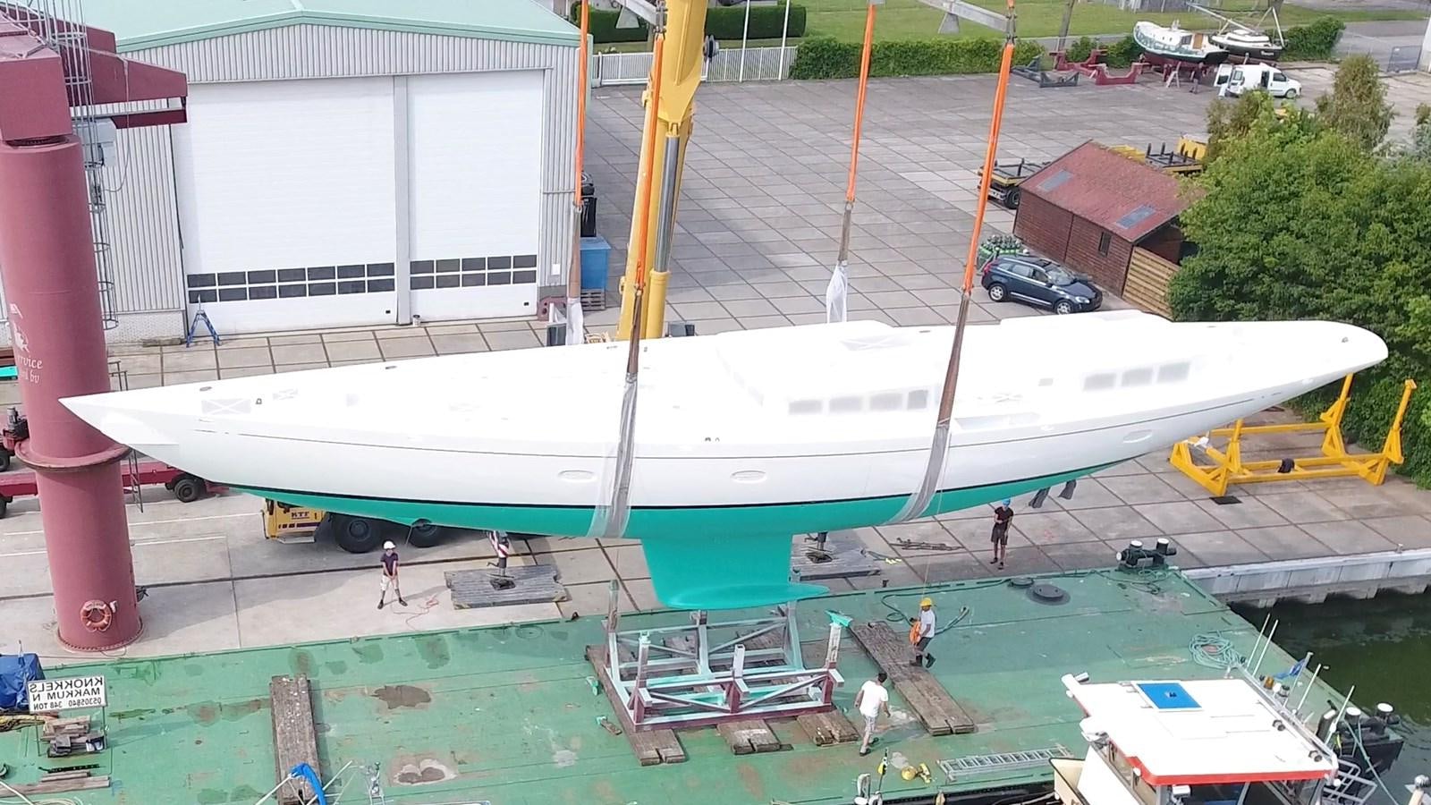 a large white boat in a yard aboard TC 90 HULL # 4 Yacht for Sale