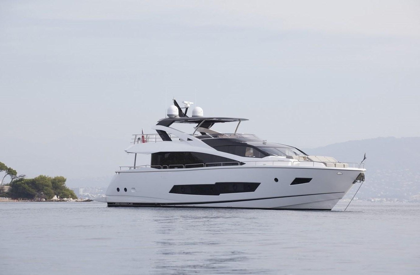 a white yacht on the water aboard SUNSEEKER 86 Yacht for Sale