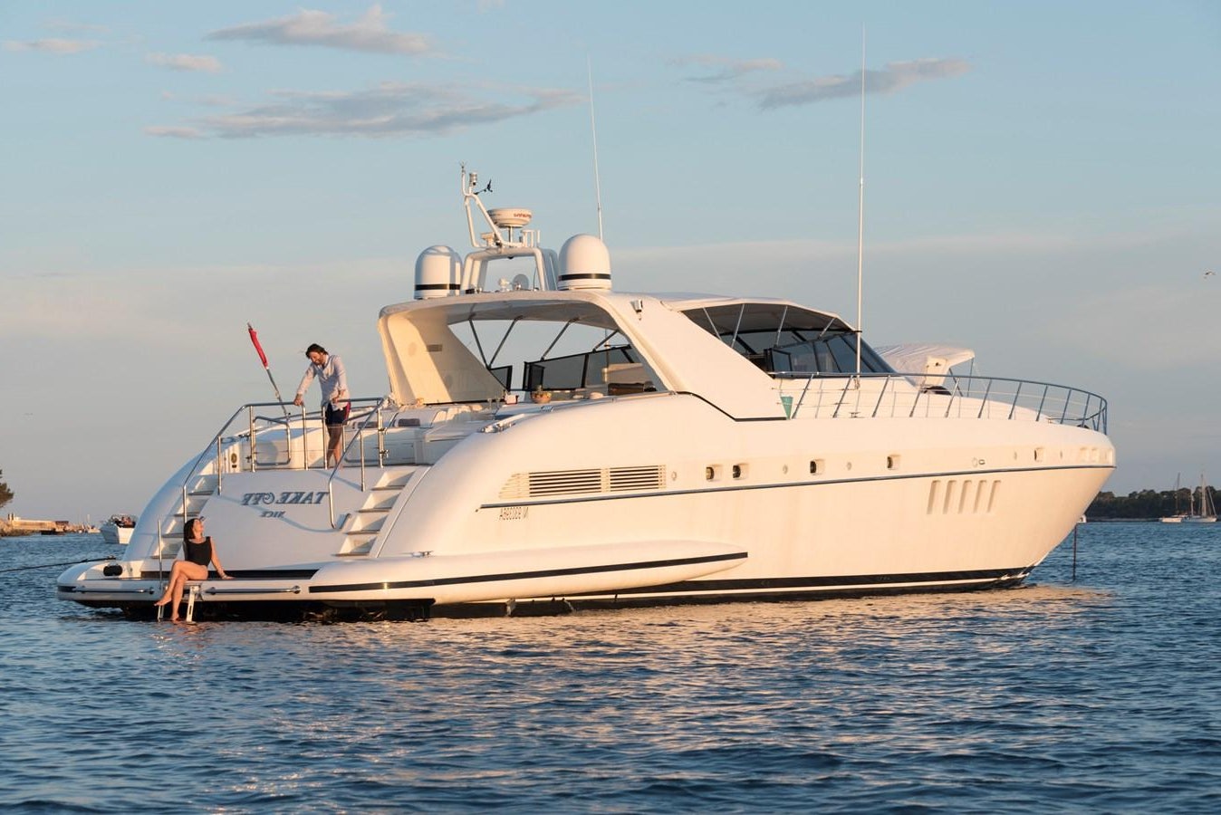 a white yacht in the water aboard TAKE OFF Yacht for Sale