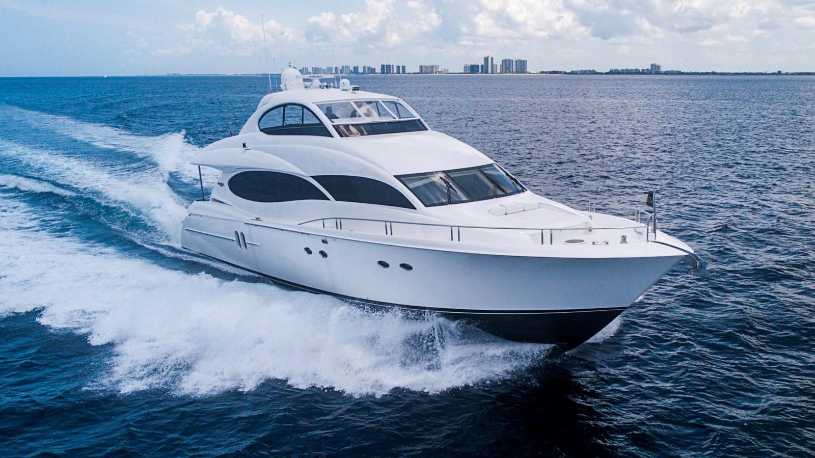a white yacht on the water aboard RENDEZVOUS Yacht for Sale