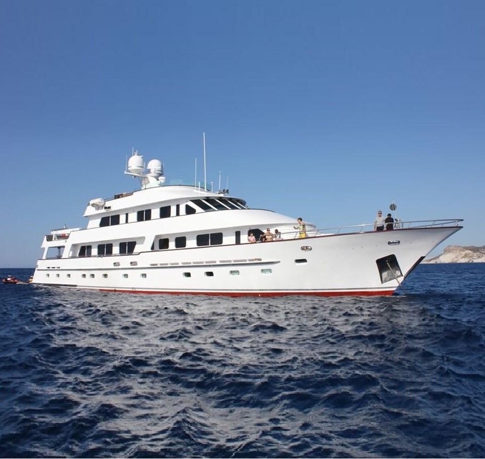 a white boat in the water aboard ATLAS Yacht for Sale