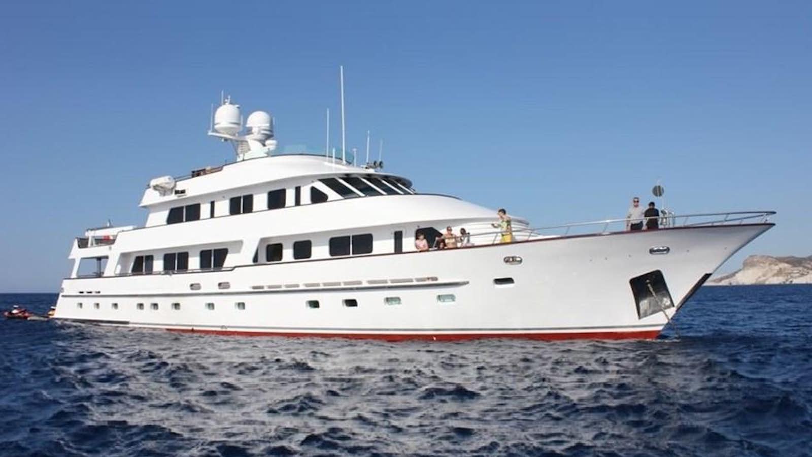 a white boat in the water aboard ATLAS Yacht for Sale