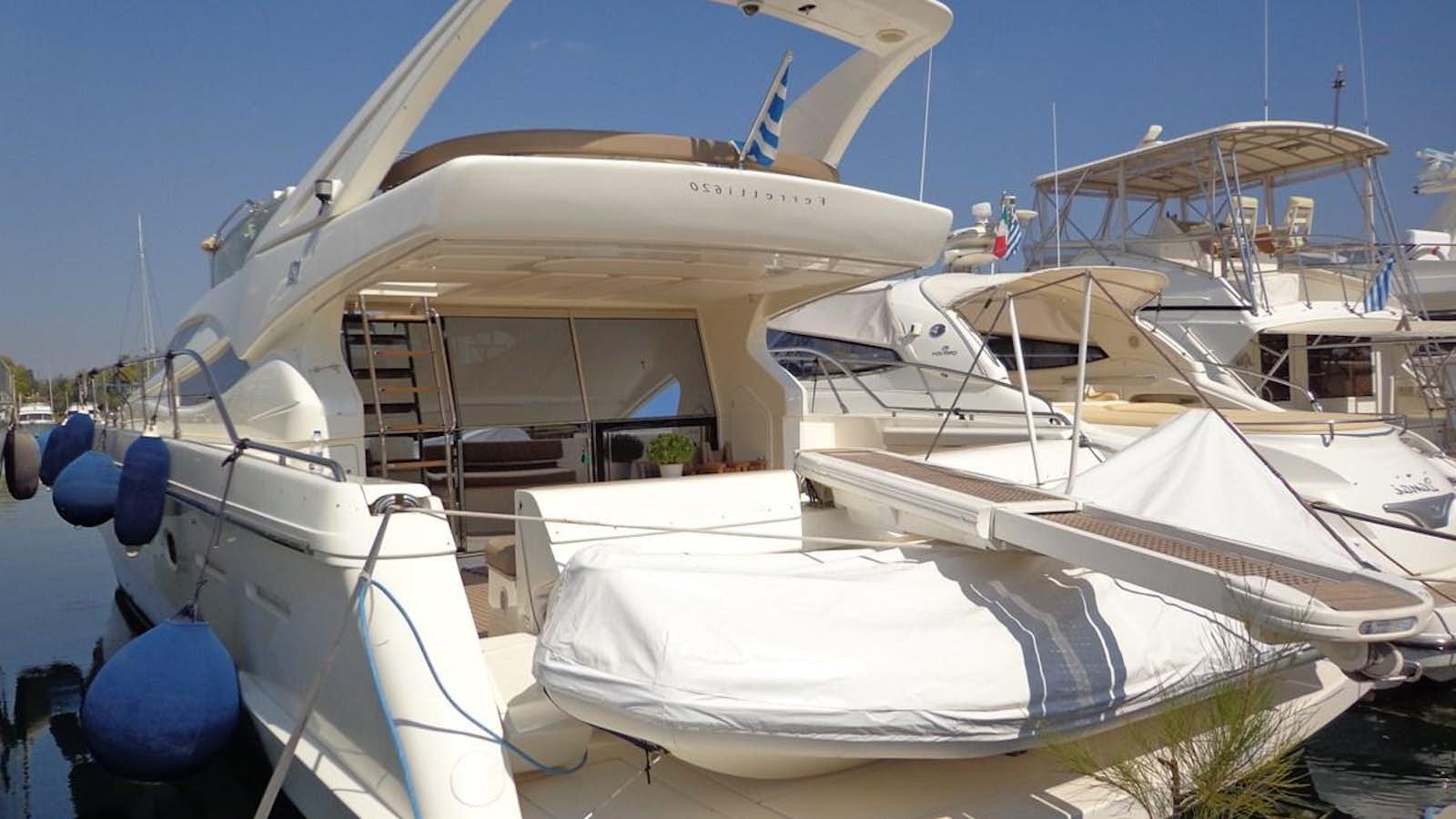 a boat docked at a pier aboard FERRETTI 620 Yacht for Sale