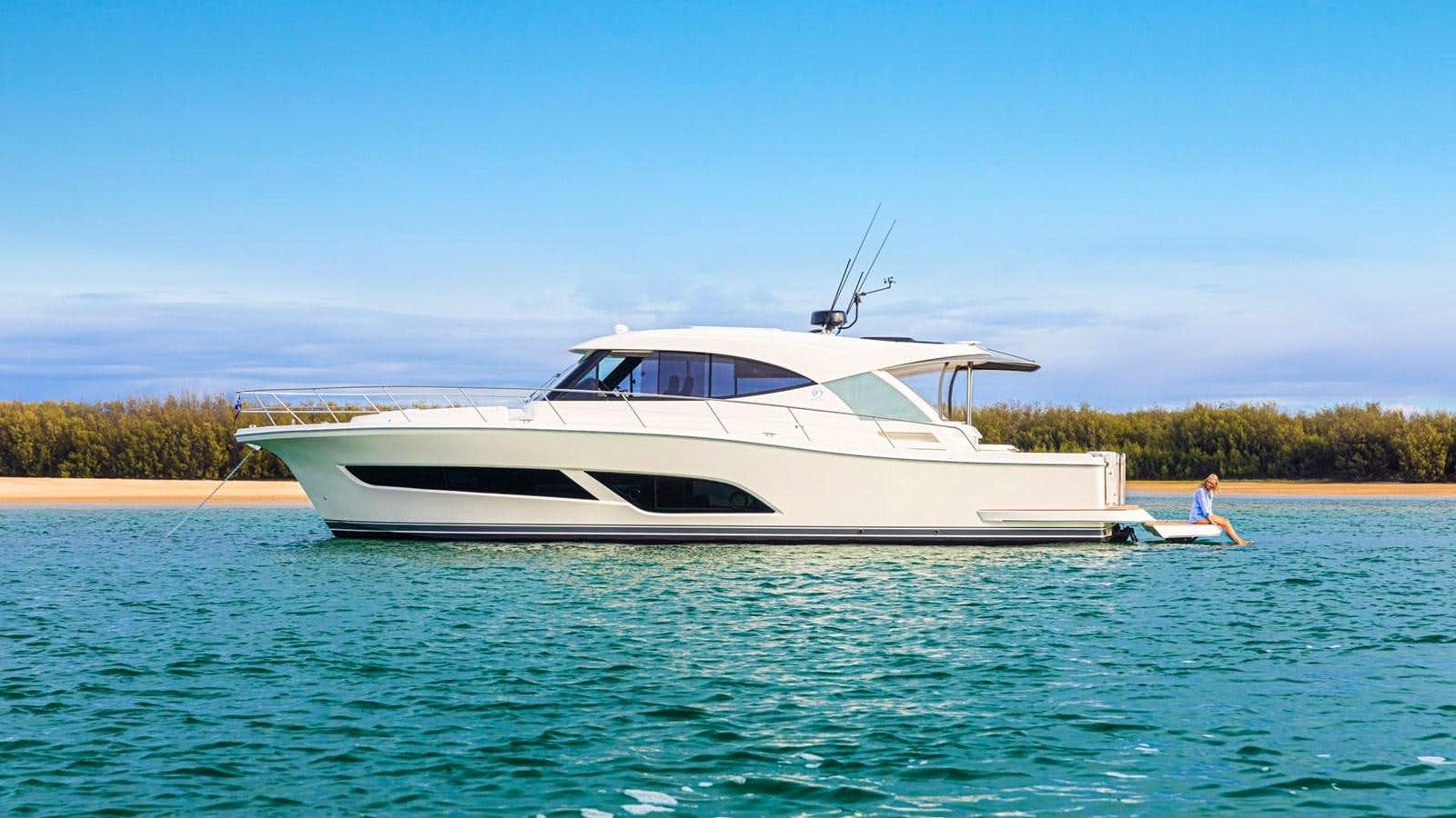 a white boat in the water aboard 505 SUV  Yacht for Sale