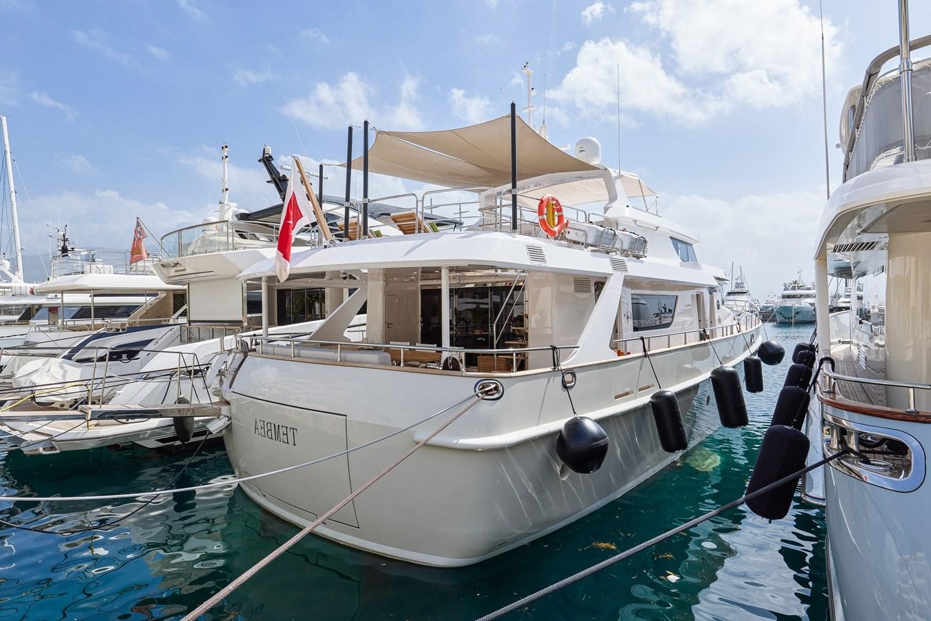 boats docked in a harbor aboard STEEL TRANSATLANTIC NAVETTA 2022 "TEMBEA" Yacht for Sale