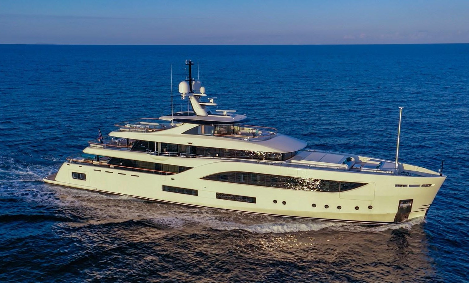 a white yacht on the beach aboard 'C Yacht for Sale