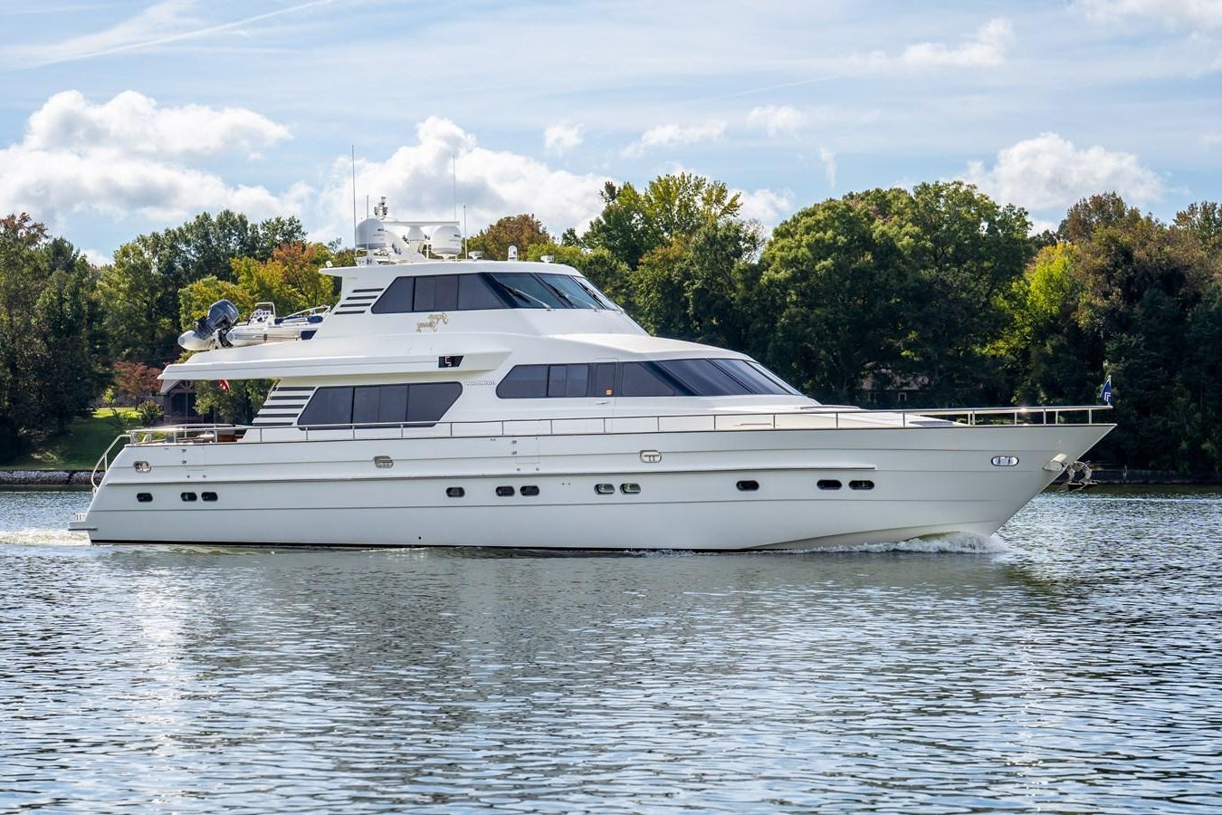 a white yacht on the water aboard JACQUE'S JOURNEY Yacht for Sale