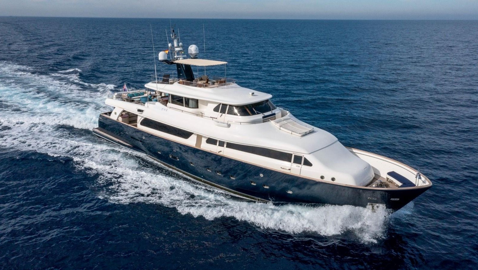 a white boat on the water aboard BIM Yacht for Sale