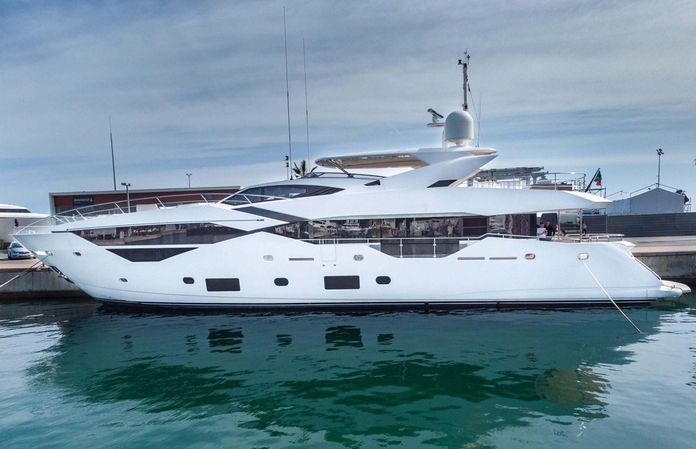 a white yacht docked aboard HKMAS Yacht for Sale