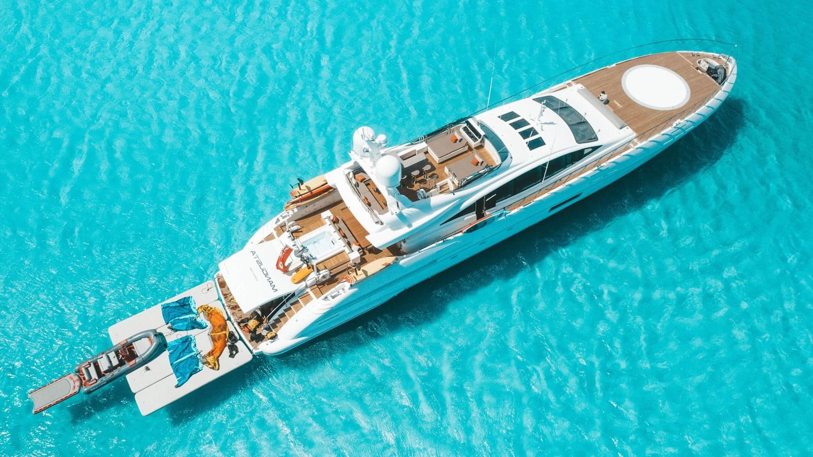 a spaceship flying over a planet aboard FIREFLY Yacht for Sale