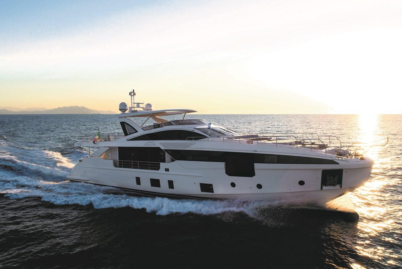 a white yacht on the water aboard LA MAMA Yacht for Sale