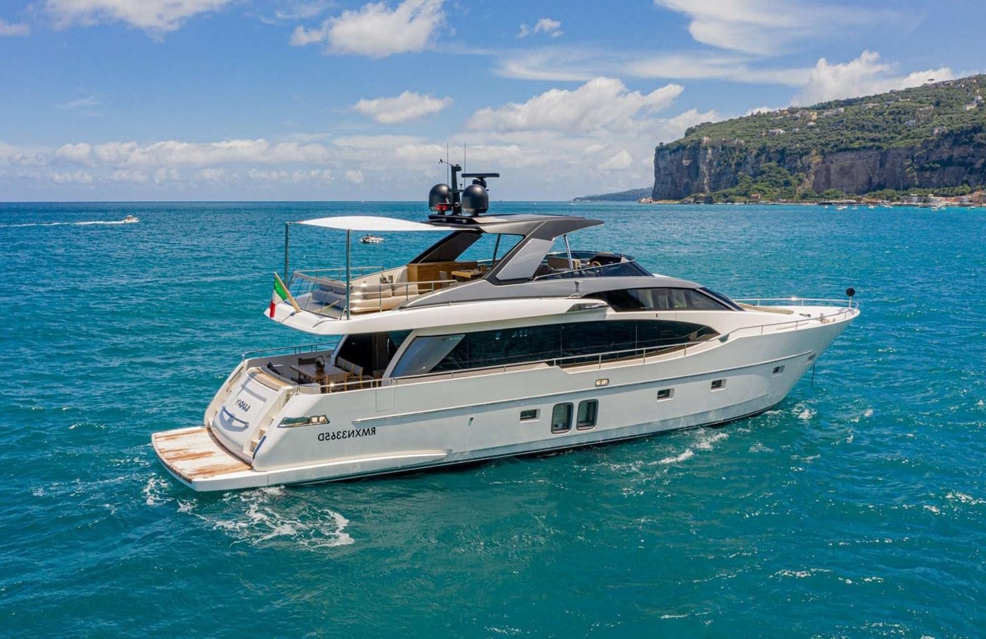 a white yacht in the water aboard LUCKY Yacht for Sale