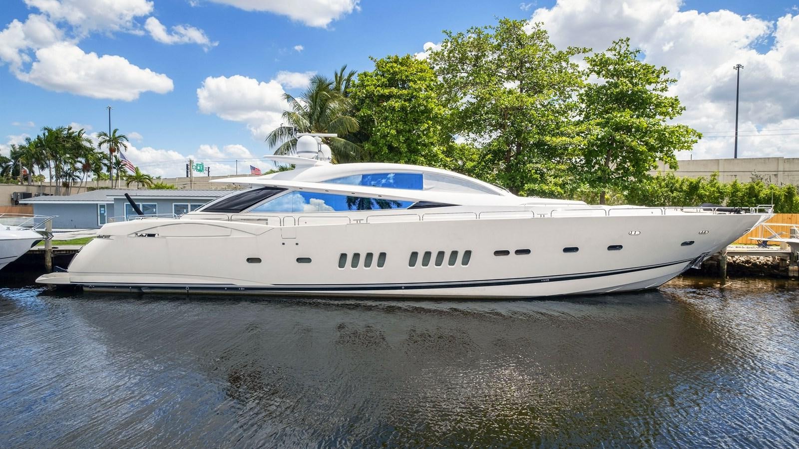 a white yacht docked at a dock aboard DIABLO BLANCO Yacht for Sale