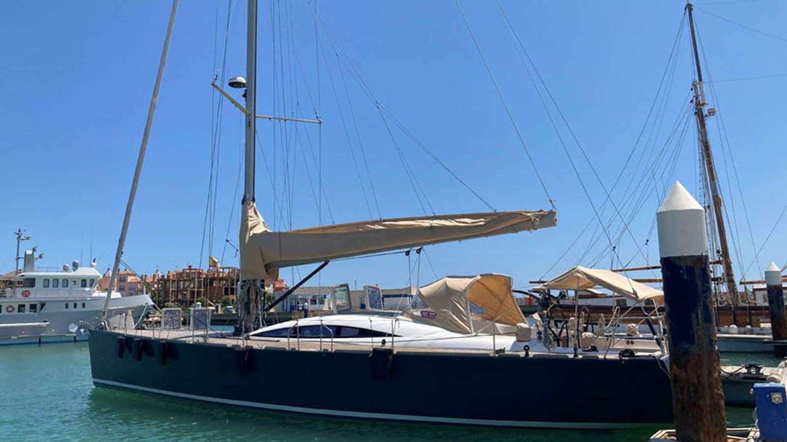 a boat docked at a pier aboard WAYRA Yacht for Sale