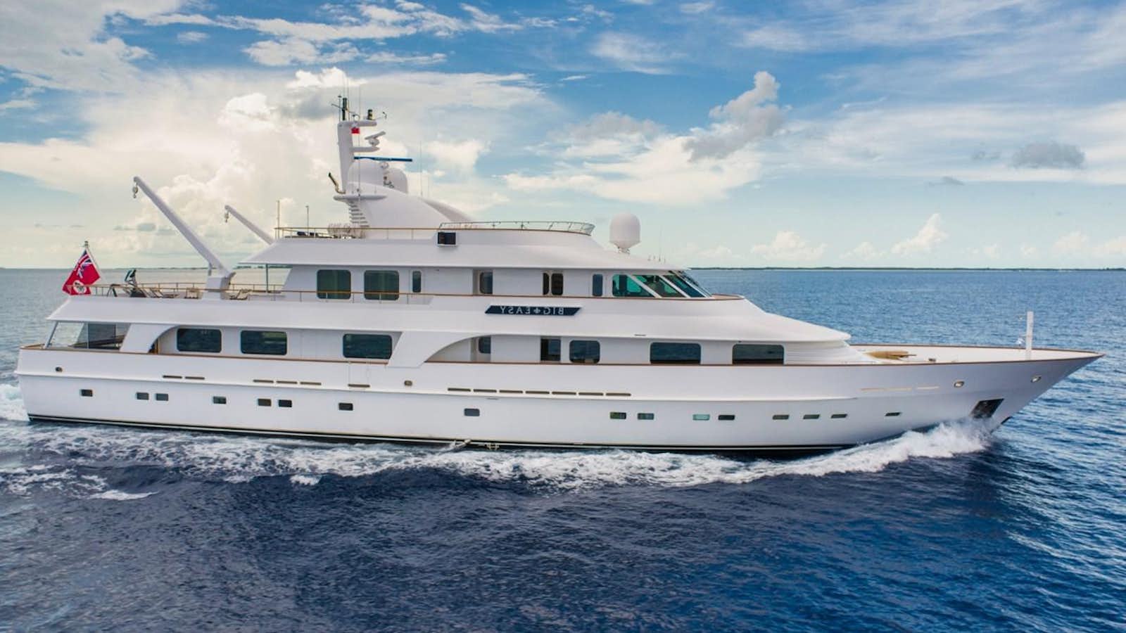 a white yacht in the water aboard BIG EASY Yacht for Sale