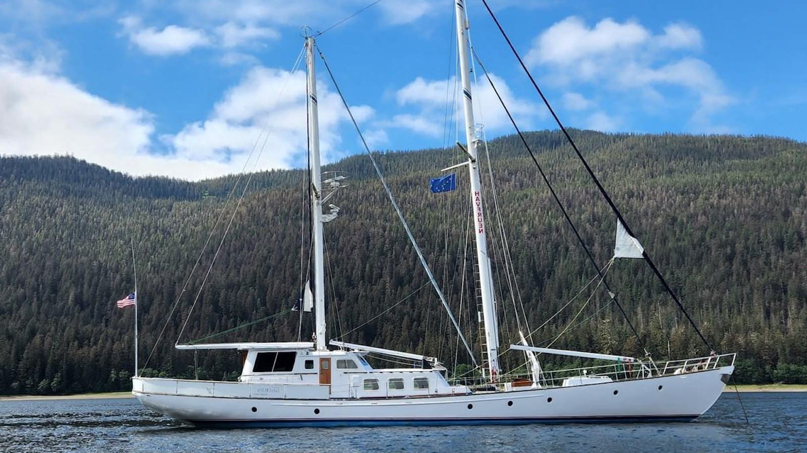 a white boat on the water aboard HAVFRUEN Yacht for Sale