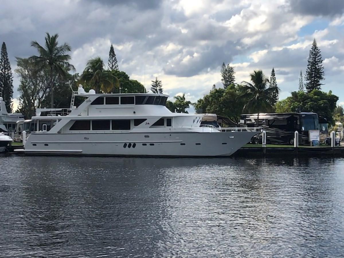 a white boat in a body of water aboard JEF82110L506 Yacht for Sale