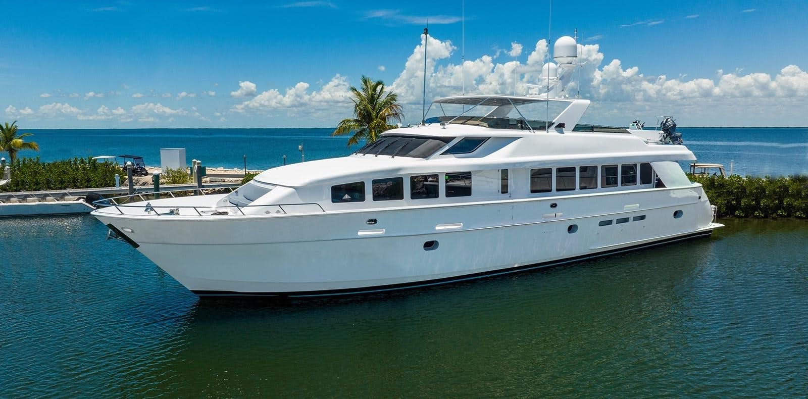 a white yacht on the water aboard PURA VIDA Yacht for Sale
