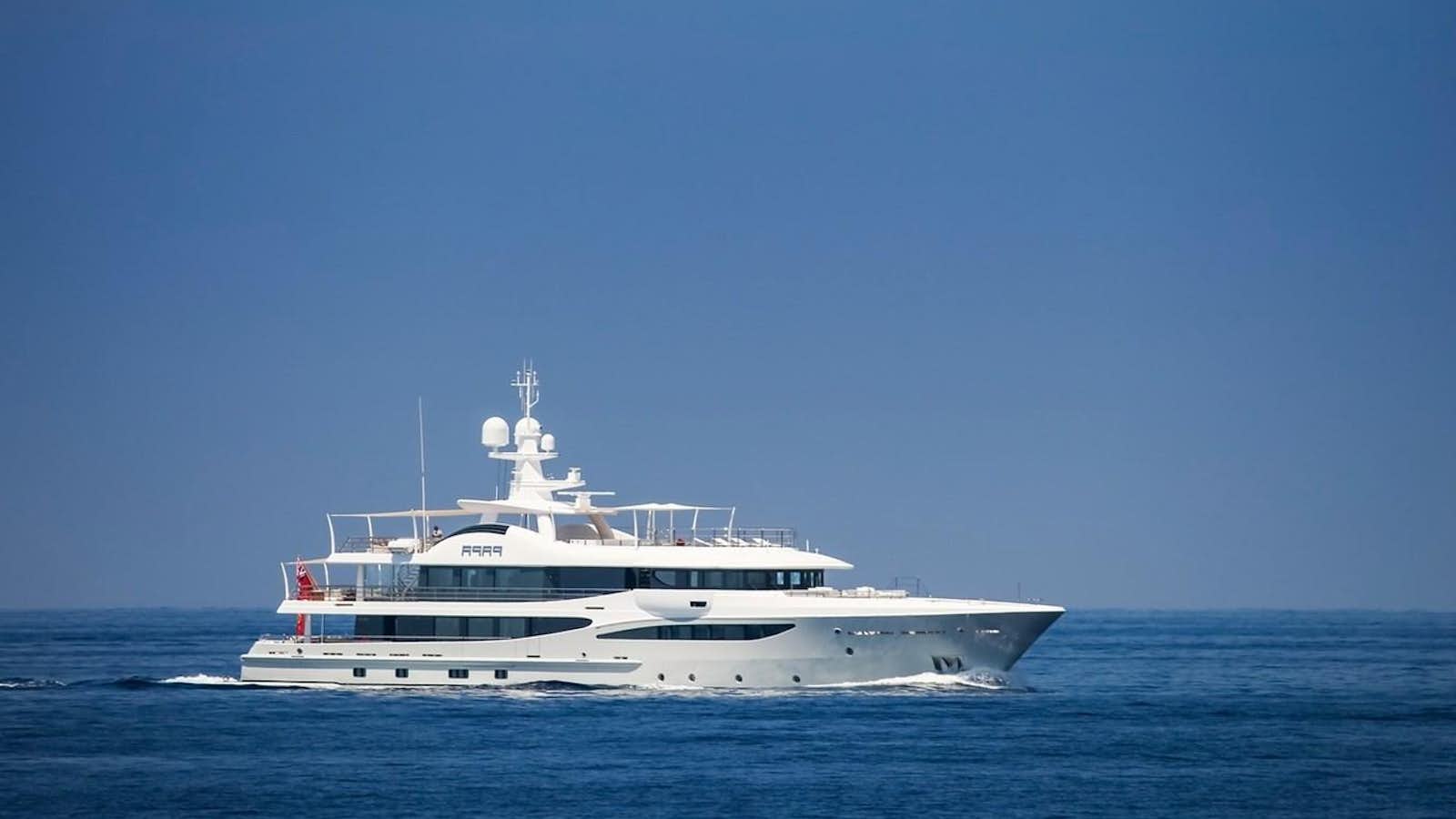 a white boat in the water aboard PAPA Yacht for Sale