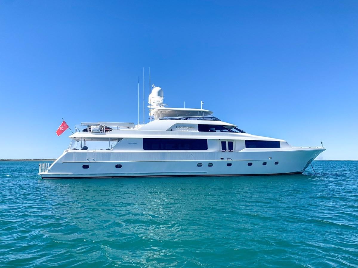 a white yacht in the water aboard SIMPLICITY Yacht for Sale