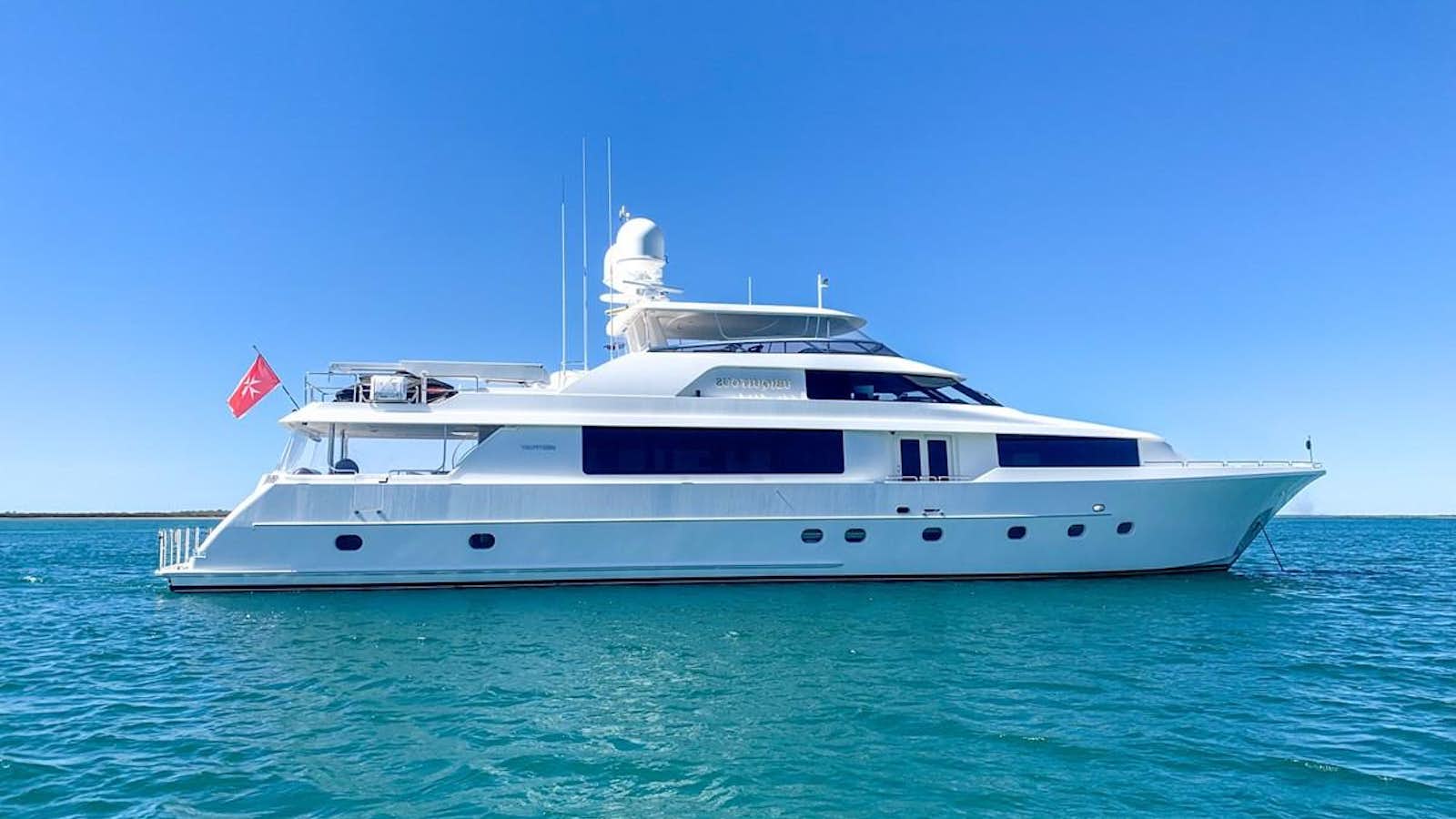 a white yacht in the water aboard SIMPLICITY Yacht for Sale