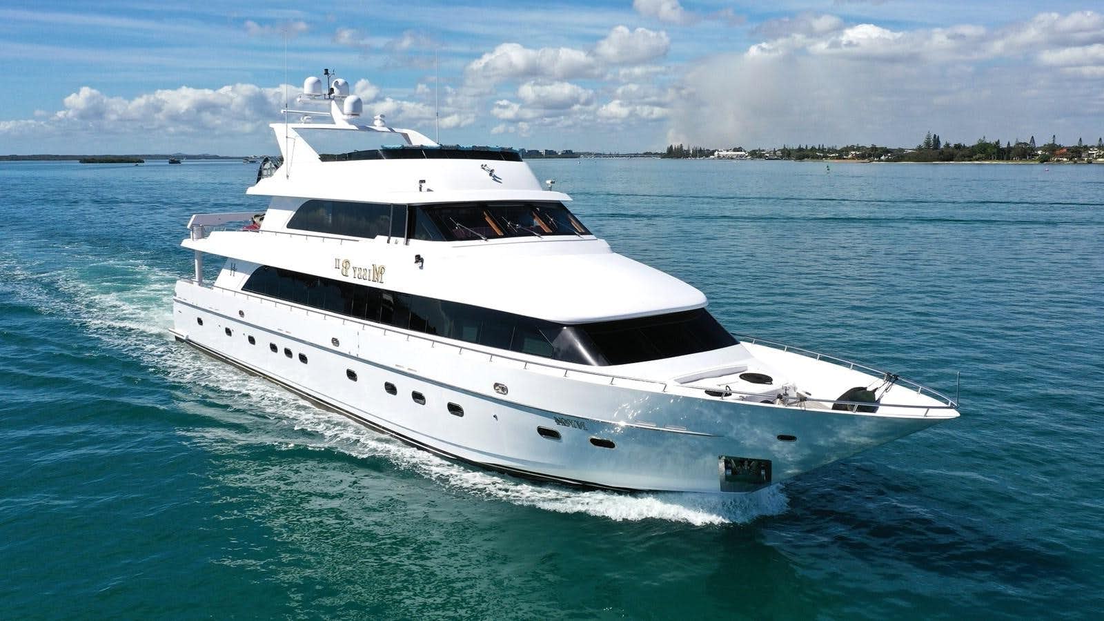 a white yacht on the water aboard MISSY B II Yacht for Sale