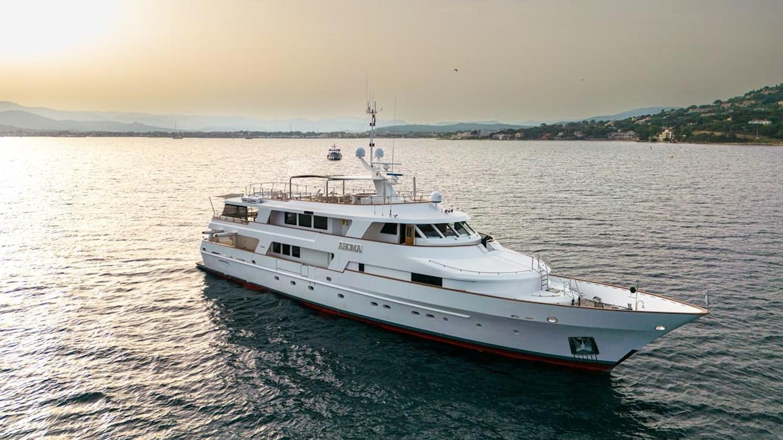 a large white boat in the water aboard AMOHA Yacht for Sale