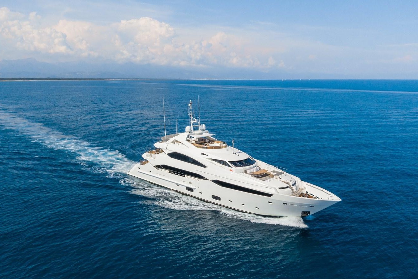 a white yacht in the water aboard DESEO Yacht for Sale