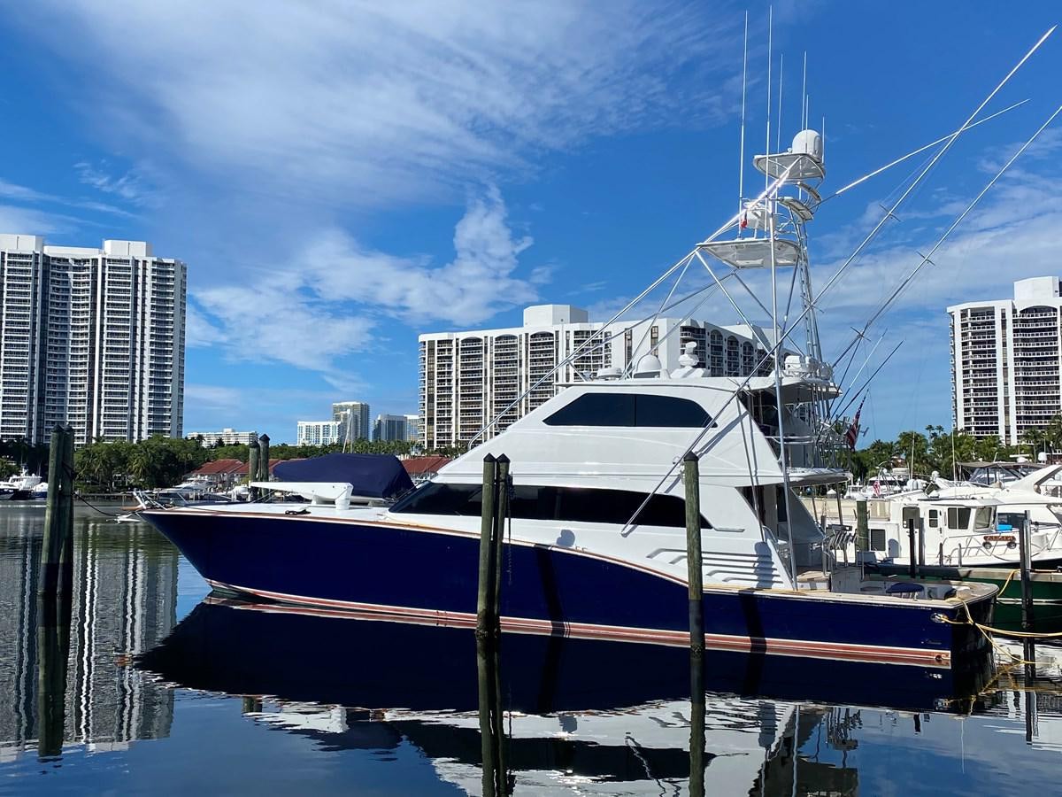 a boat docked at a pier aboard REEL DEAL Yacht for Sale