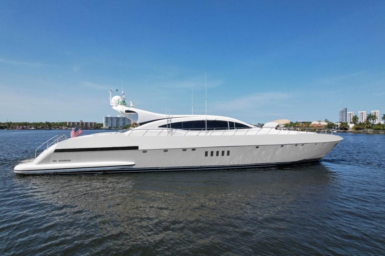 a white yacht on the water aboard 108' MANGUSTA 2002 Yacht for Sale