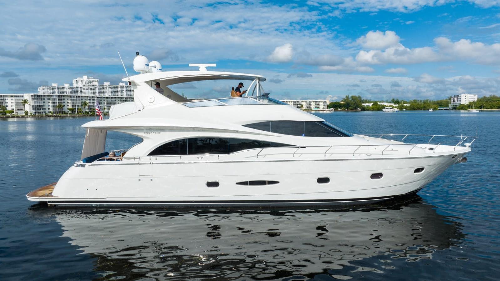 a white yacht on the water aboard GRATITUDE Yacht for Sale