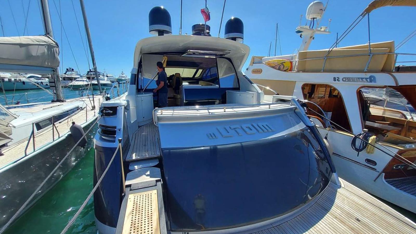 a boat docked at a pier aboard MIOTU III Yacht for Sale