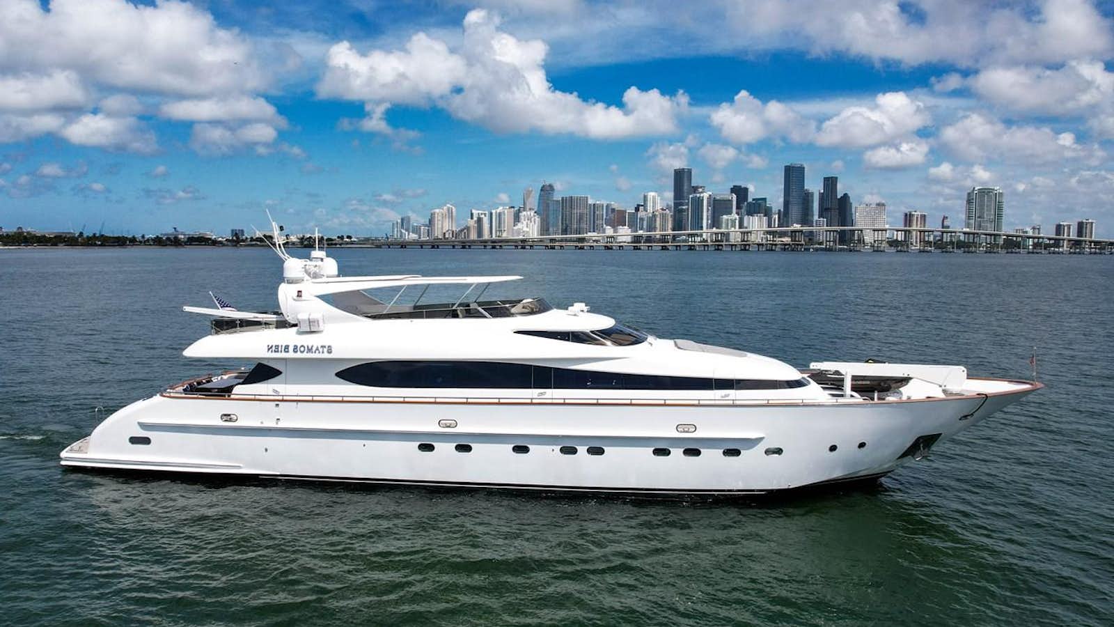 a white yacht in the water aboard STAMOS BIEN Yacht for Sale
