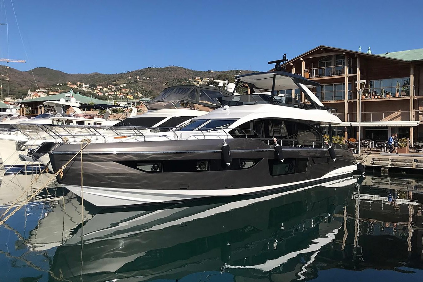 a boat docked at a pier aboard SUNSTROKE Yacht for Sale