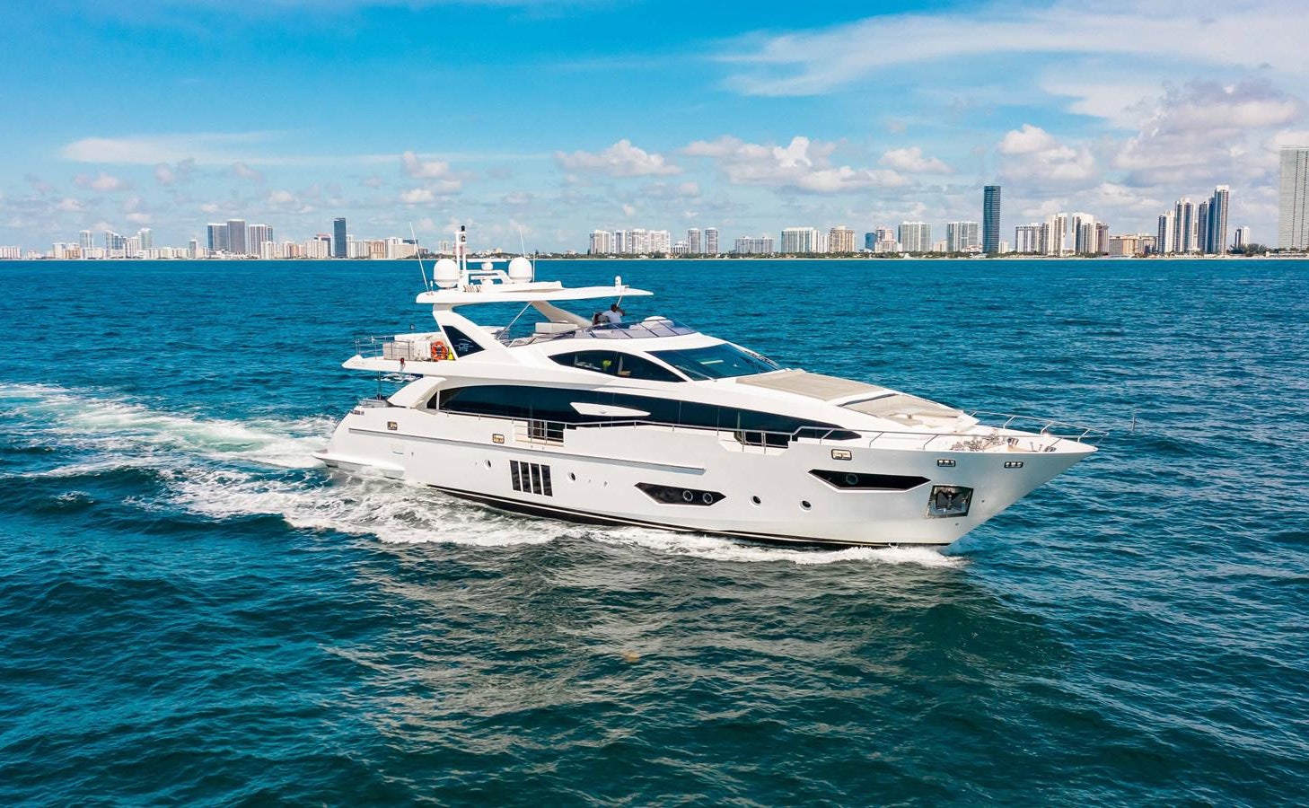 a white yacht in the water aboard INDIGO Yacht for Sale