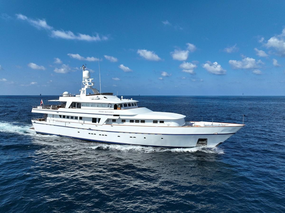 a white yacht in the water aboard CHEETAH MOON Yacht for Sale