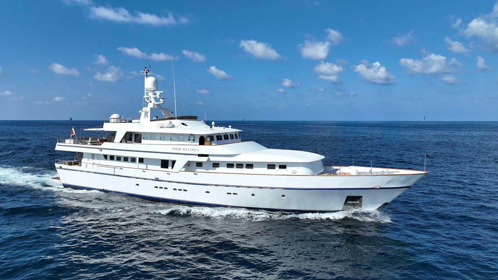 a white yacht in the water aboard CHEETAH MOON Yacht for Sale