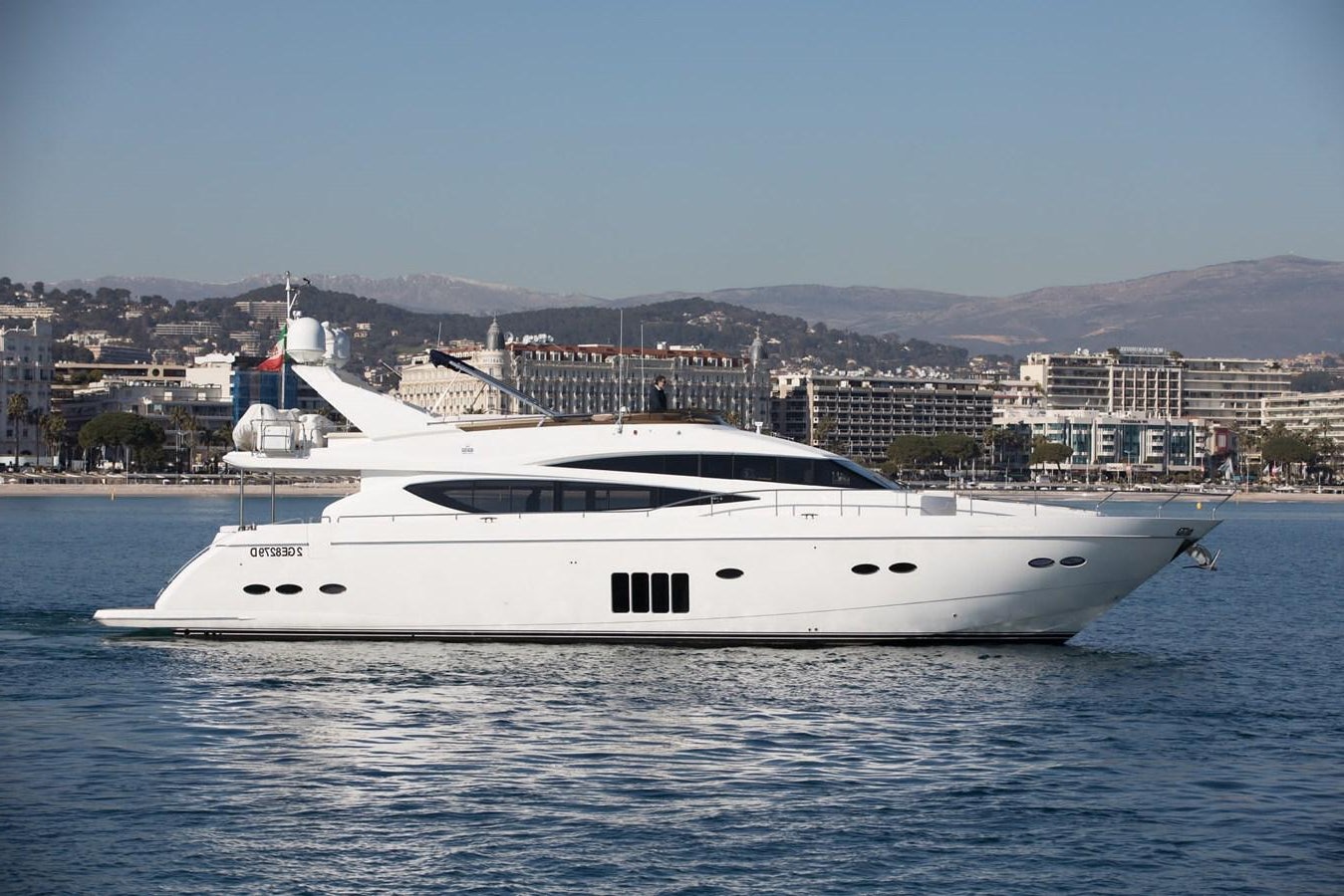 a white yacht in the water aboard 2009 PRINCESS 85 Yacht for Sale