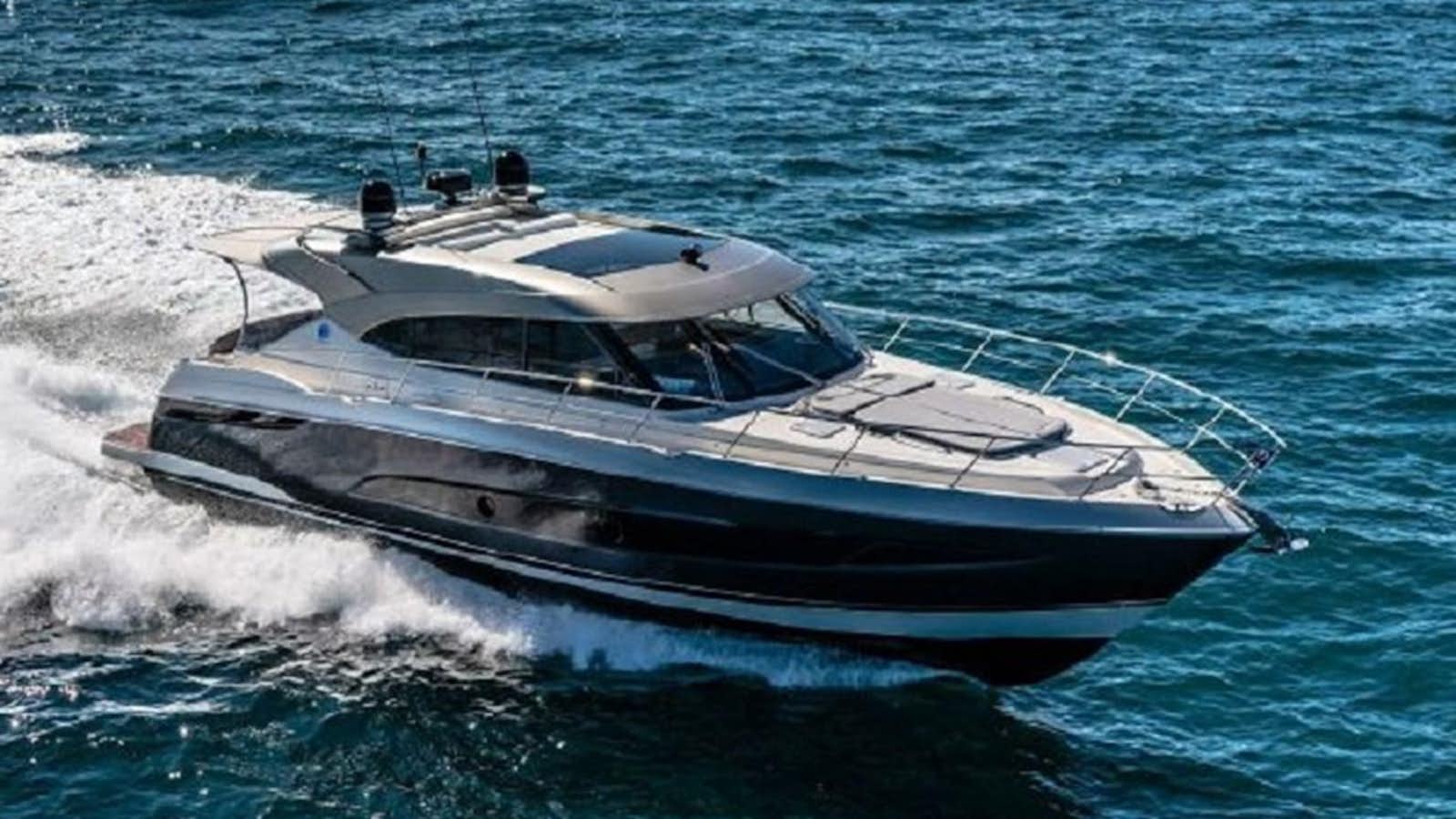 a boat on the water aboard 2023 RIVIERA 5400 SPORT YACHT Yacht for Sale