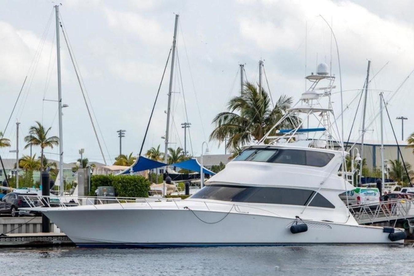 a white yacht in the water aboard ENCLOSED BRIDGE Yacht for Sale