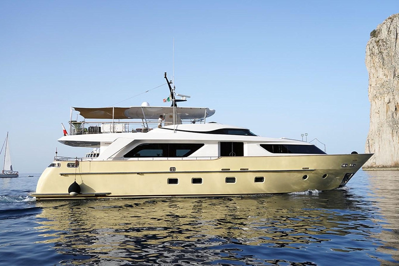 a white yacht in the water aboard AKUA Yacht for Sale