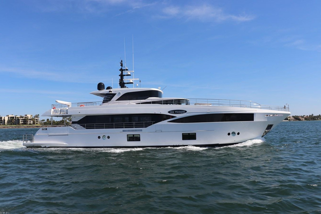 a white yacht on the water aboard KRISHH Yacht for Sale