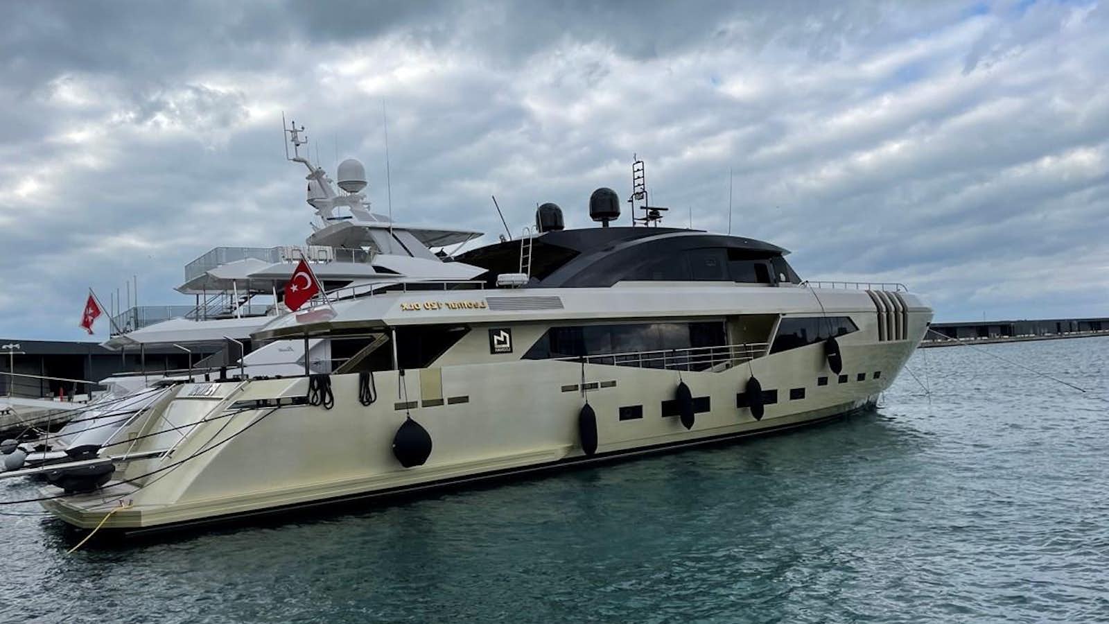 a white yacht in the water aboard AQUILA Yacht for Sale