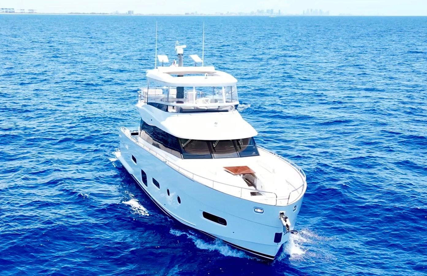 a white boat in the water aboard RAINBOW GODDESS Yacht for Sale