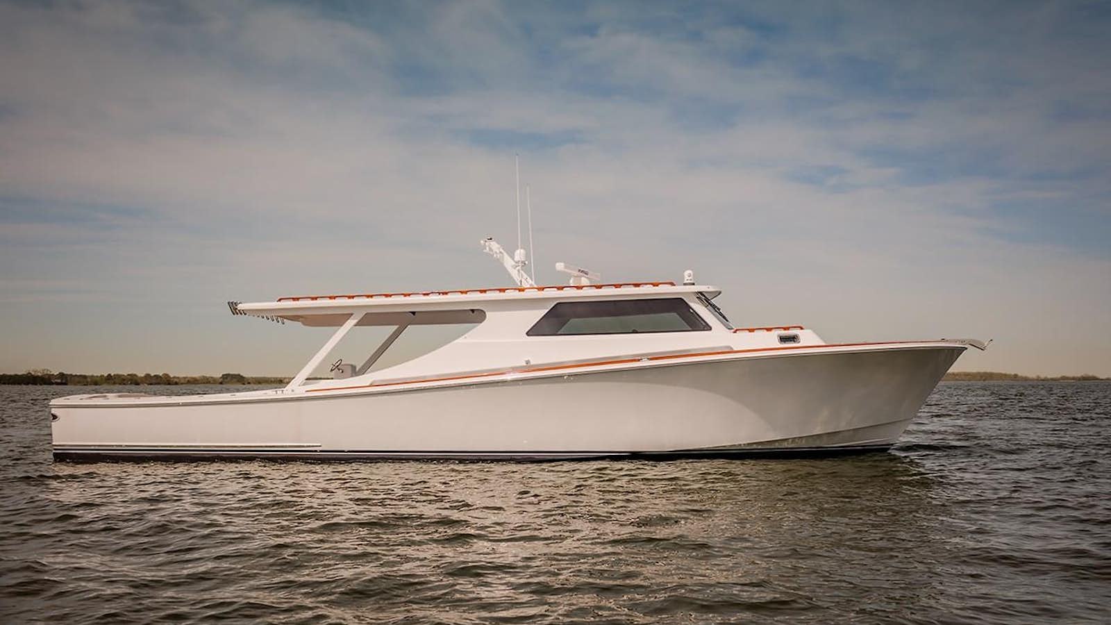 a white boat on the water aboard CY55 Yacht for Sale